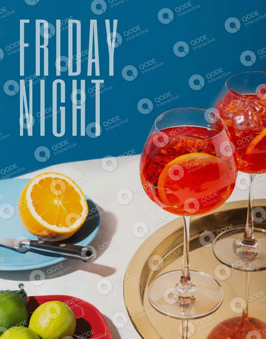 Two orange cocktails with an orange slice and pen on a Friday night.