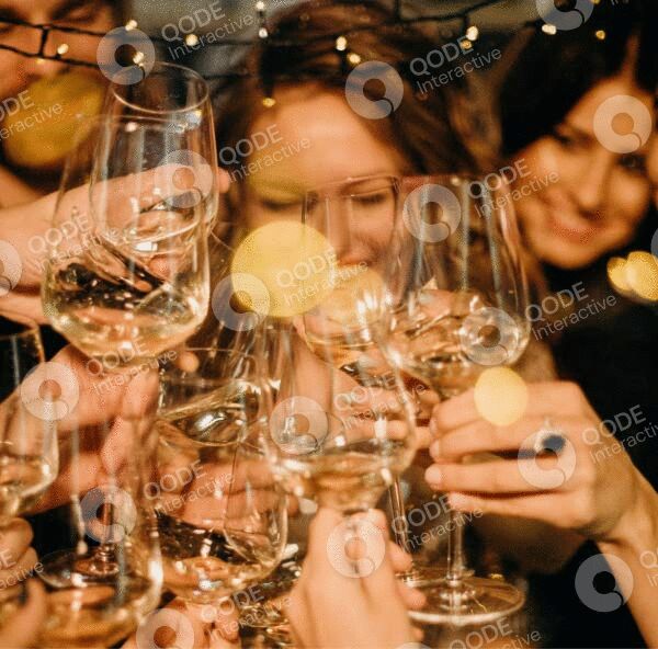Friends cheer with wine glasses in a festive celebration.