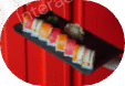 A variety of sushi rolls arranged on a black tray.