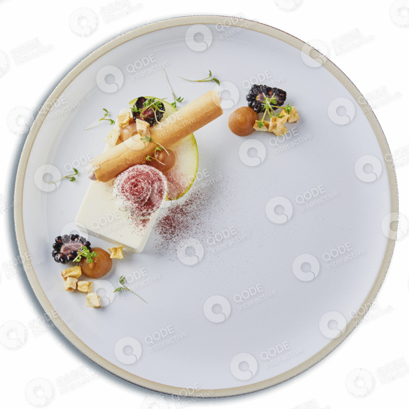 Artistic gourmet dish with delicate garnishes on a white plate.