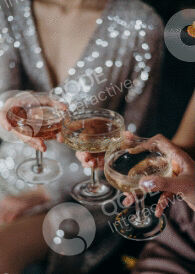 People toasting with champagne glasses at a celebration.