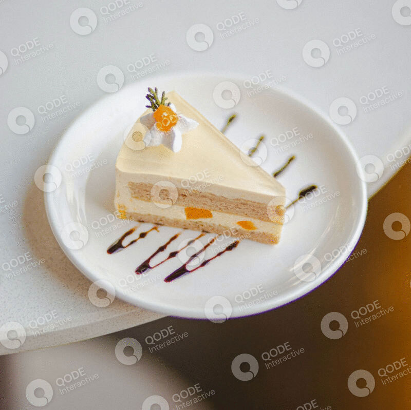 A slice of layered fruit cake on a white plate with chocolate drizzle.