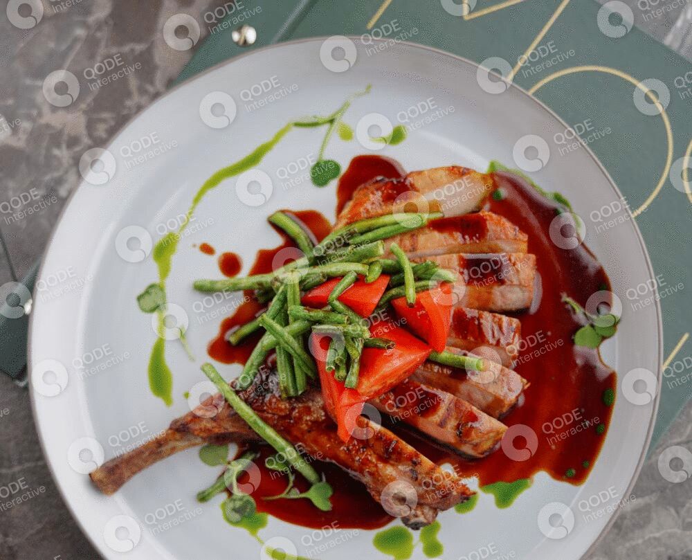 Grilled chicken served with fresh herbs and a rich red sauce.