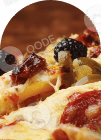 Close-up of a cheesy pizza slice topped with black olives, pepperoni, and green peppers.