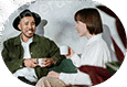 Two friends laughing and enjoying coffee together.