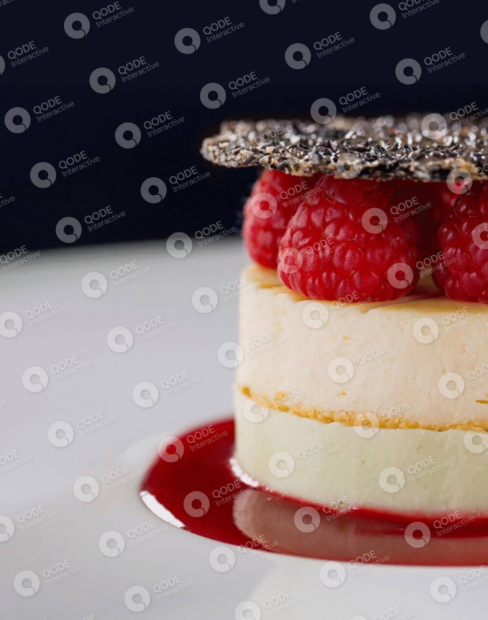 Elegant layered dessert with raspberries and chocolate crust.