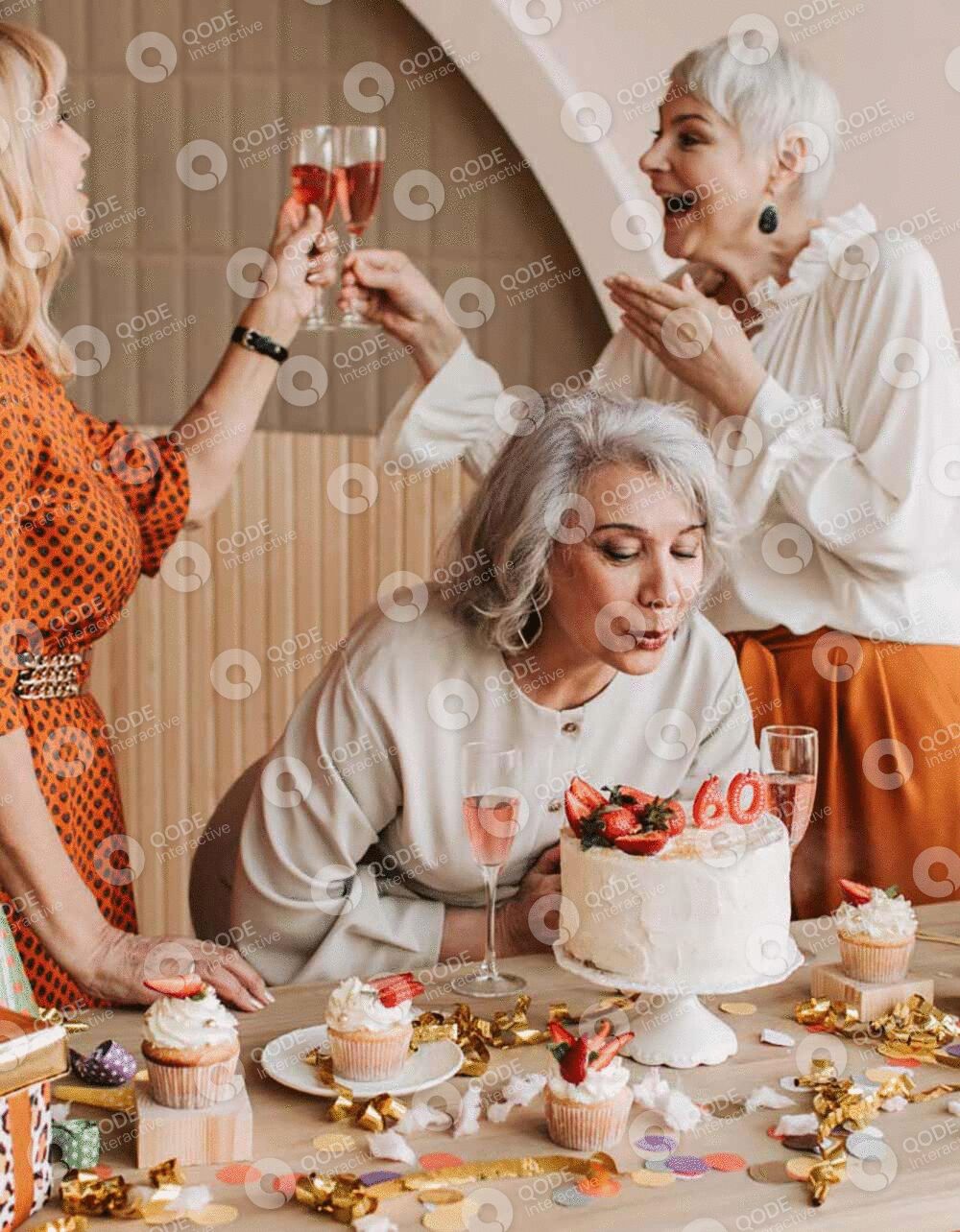 Three women celebrating with a cake and champagne in a cozy setting.