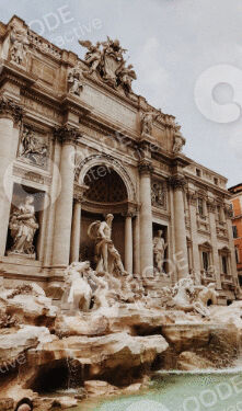 The iconic Trevi Fountain in Rome with detailed sculptures and flowing water.