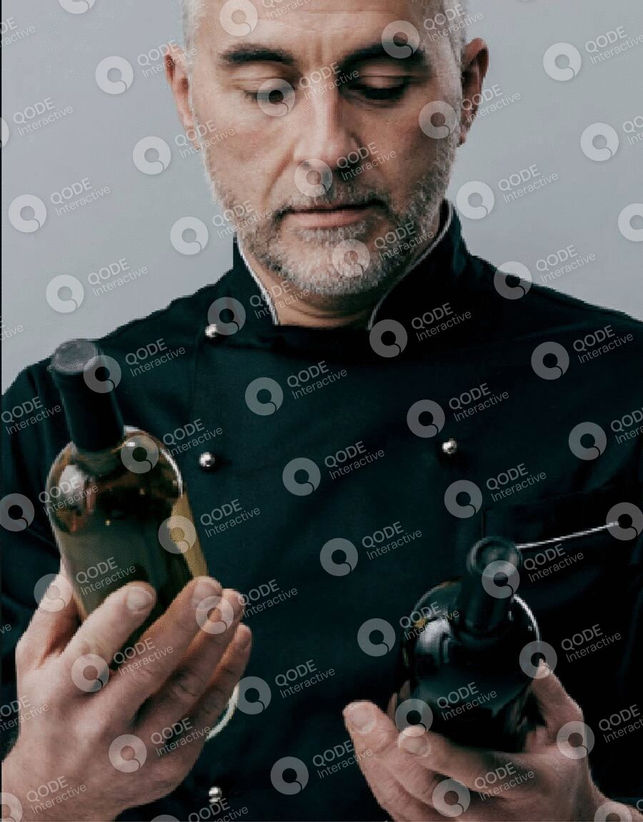 Man holding vintage camera equipment, focusing on details.