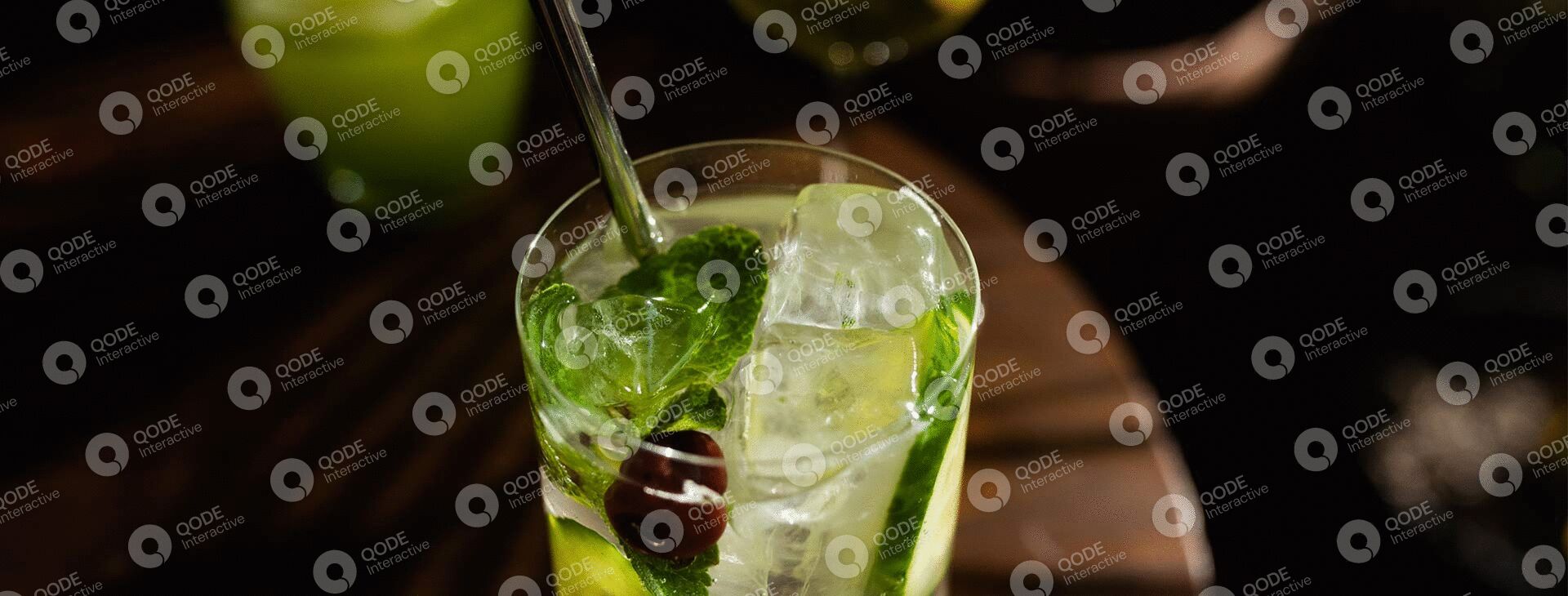 Refreshing mojito cocktail with lime, mint, and olives.
